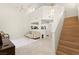 Bright living room boasts soaring ceilings, tile floors, and an open layout connecting to the kitchen at 68 Belle Soleil Ave, Las Vegas, NV 89123