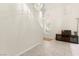 Spacious living room is bathed in natural light, featuring high ceilings and tile flooring, ideal for relaxing at 68 Belle Soleil Ave, Las Vegas, NV 89123
