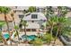 A high angle shows a property with a pool, outdoor kitchen, and landscaping, surrounded by palm trees at 691 Vineland Ave, Henderson, NV 89052