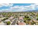 A vibrant neighborhood featuring well-maintained homes and mature trees, offers a sense of community and curb appeal at 691 Vineland Ave, Henderson, NV 89052
