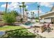 Landscaped backyard features a built-in barbeque and an in-ground pool, ideal for entertaining guests at 691 Vineland Ave, Henderson, NV 89052