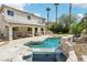 Inviting backyard with covered patio, lagoon style pool, and built in barbeque, perfect for outdoor gatherings at 691 Vineland Ave, Henderson, NV 89052