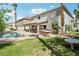 A backyard featuring a pool and covered patio offers an ideal retreat for relaxation and outdoor entertainment at 691 Vineland Ave, Henderson, NV 89052