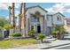 Stunning two-story stucco home with stone accents, arched entryway, and well-manicured front yard at 691 Vineland Ave, Henderson, NV 89052