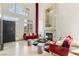 Open foyer featuring tall ceilings, stone fireplace, natural light, and stylish decor at 691 Vineland Ave, Henderson, NV 89052
