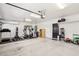 Spacious garage with ample room for parking and storage, plus exercise equipment at 691 Vineland Ave, Henderson, NV 89052