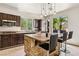 Spacious kitchen features ample counter space, dark wood cabinetry, and modern stainless steel appliances at 691 Vineland Ave, Henderson, NV 89052