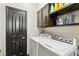 A functional laundry room with modern appliances and ample storage space at 691 Vineland Ave, Henderson, NV 89052
