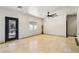 Bright living room featuring tile floors and an entry door at 691 Vineland Ave, Henderson, NV 89052