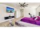 Main bedroom with mounted TV and doors to closet at 691 Vineland Ave, Henderson, NV 89052