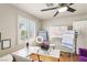 Home office space with natural light, white board, and modern decor, ideal for productivity at 691 Vineland Ave, Henderson, NV 89052