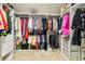 Well-organized walk-in closet with shelving, hanging rods, and ample storage space for clothing at 691 Vineland Ave, Henderson, NV 89052