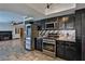 Kitchen with stainless steel appliances and easy access to the living room at 722 Barrie Ct, Henderson, NV 89002
