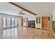 Bright living room features fireplace, french doors, custom built-ins and wood flooring at 722 Barrie Ct, Henderson, NV 89002