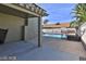 A covered patio extends to the pool area, perfect for relaxing and entertaining guests outdoors at 722 Barrie Ct, Henderson, NV 89002