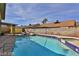 Backyard pool with a diving board, patio, and a bright blue sky at 722 Barrie Ct, Henderson, NV 89002