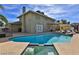 Backyard pool with a diving board, patio, and a bright blue sky at 722 Barrie Ct, Henderson, NV 89002