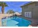 The backyard pool has a basketball hoop and spa, perfect for outdoor relaxation and entertainment at 722 Barrie Ct, Henderson, NV 89002