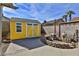 A well-maintained yellow shed offers extra storage space in the backyard, complemented by a pump system at 722 Barrie Ct, Henderson, NV 89002