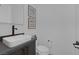 Modern powder room featuring a sleek vessel sink, black faucet, and contemporary design at 787 Willits St, Las Vegas, NV 89138
