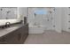 Modern bathroom featuring a standalone tub, glass shower, and sleek vanity at 787 Willits St, Las Vegas, NV 89138