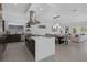 Open-concept kitchen with a large island, stainless appliances, and seamless flow to the dining area at 787 Willits St, Las Vegas, NV 89138