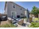 Outdoor patio with wicker furniture, barbecue area, and manicured landscaping for outdoor enjoyment at 7890 S Miller Ln, Las Vegas, NV 89113