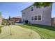 Beautiful backyard featuring a putting green, patio, and well-maintained lawn, great for outdoor activities at 7890 S Miller Ln, Las Vegas, NV 89113