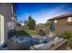 Cozy backyard patio with comfortable seating and green lawn at 7890 S Miller Ln, Las Vegas, NV 89113