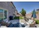 Inviting backyard patio with comfortable seating and a dining area, perfect for outdoor entertaining at 7890 S Miller Ln, Las Vegas, NV 89113