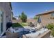 Inviting backyard patio with comfortable seating and a dining area, perfect for outdoor entertaining at 7890 S Miller Ln, Las Vegas, NV 89113