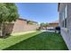 Lush backyard with a putting green and patio area, ideal for relaxation and recreation at 7890 S Miller Ln, Las Vegas, NV 89113