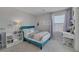 Bright bedroom features a large bookshelf, and a desk at 7890 S Miller Ln, Las Vegas, NV 89113