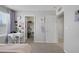 Bright bedroom with closet, desk, and neutral decor at 7890 S Miller Ln, Las Vegas, NV 89113