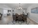 Spacious dining room with decorative chandelier, and views to the kitchen at 7890 S Miller Ln, Las Vegas, NV 89113