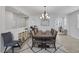 Stylish dining room with modern chandelier, wood-look floors, and decorative accents at 7890 S Miller Ln, Las Vegas, NV 89113