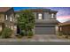 Charming two-story home featuring a gray exterior, tile roof, and a two-car garage at 7890 S Miller Ln, Las Vegas, NV 89113