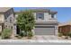 Charming two-story home featuring a two-car garage, desert landscaping, and a well-maintained front yard at 7890 S Miller Ln, Las Vegas, NV 89113