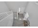 Bright foyer with wood-look tile flooring and a staircase leading to the upper level at 7890 S Miller Ln, Las Vegas, NV 89113