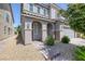 Charming home with neutral-toned stucco, brick pathway, and well-maintained landscaping at 7890 S Miller Ln, Las Vegas, NV 89113