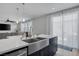 The kitchen features stainless steel double sink and open access to backyard at 7890 S Miller Ln, Las Vegas, NV 89113