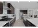 Modern kitchen features stainless steel appliances and white backsplash at 7890 S Miller Ln, Las Vegas, NV 89113