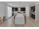 Kitchen with eat-in island and stainless appliances at 7890 S Miller Ln, Las Vegas, NV 89113