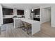 Eat-in kitchen features a breakfast bar island with pendant lighting at 7890 S Miller Ln, Las Vegas, NV 89113