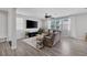 Cozy living room with modern ceiling fan, large windows and a comfortable sofa at 7890 S Miller Ln, Las Vegas, NV 89113