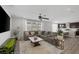 Bright living room featuring a modern ceiling fan and an open layout to the kitchen at 7890 S Miller Ln, Las Vegas, NV 89113