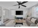 Cozy living room features large television, modern decor, and comfortable seating for relaxation at 7890 S Miller Ln, Las Vegas, NV 89113