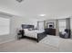 Inviting main bedroom with natural light, a king-size bed, and dark furniture for a relaxing retreat at 7890 S Miller Ln, Las Vegas, NV 89113