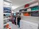Spacious walk-in closet with custom shelving and storage solutions for wardrobe organization and accessories at 7890 S Miller Ln, Las Vegas, NV 89113