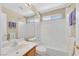 Bathroom features a vanity, a mirror and a shower-tub combo with white tile at 7920 Turtle Island Ct, Las Vegas, NV 89129